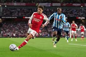 Tzolis shines as Arsenal opens Premier League season by sweeping aside promoted Coventry